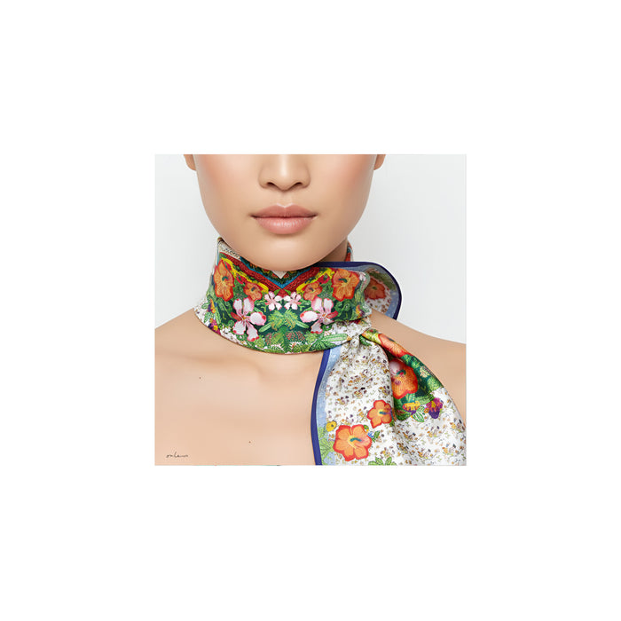 Onlewo 'Glorious Nyonya' silk scarf styled — vibrant Peranakan nyonya figures in garden setting, bold colours inspired by European, Malay and Chinese cultures