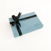 Onlewo 'Peranakan Story' silk pocket square gift box — powder blue velvet box 16cm x 11cm x 2.5cm tied with black Onlewo branded satin ribbon, with story card